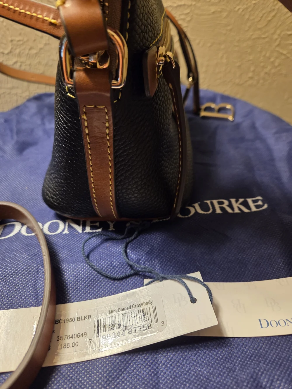 Dooney & Bourke NWT Black Pebble Leather Crossbody with Brown Trim. Logo charms